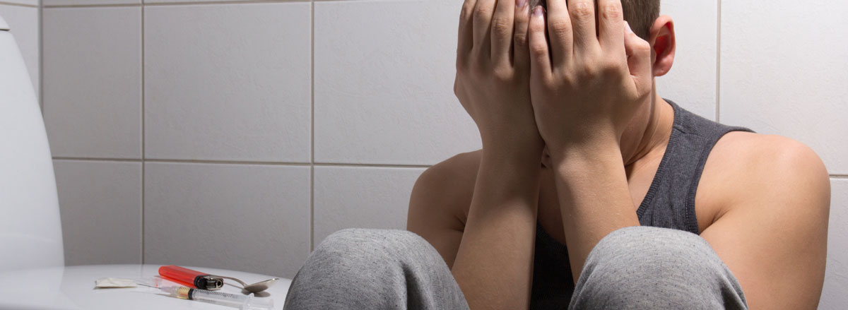 man depressed due to heroin use